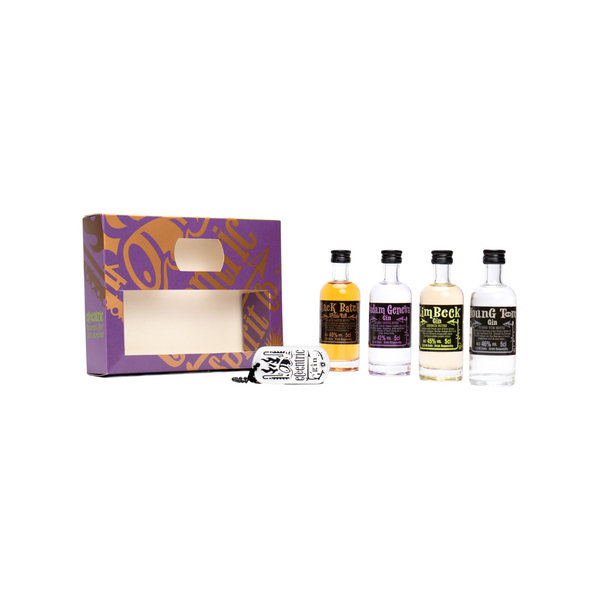 Each 5cl bottle in our Maverick Miniatures Collection - Young Tom, Limbeck and Madam Geneva Welsh gins and our Black Batch Welsh Rum - standing side by side next to the purple and gold gift box, with the signature Eccentric dog tag leaning on its side against the gift box.